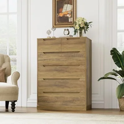 A drawer chest in a bedroom, photographed after the drawing changed twice.